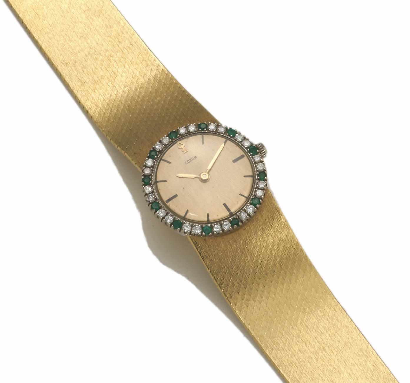 Appraisal: An emerald diamond and eighteen karat gold integral bracelet wristwatch