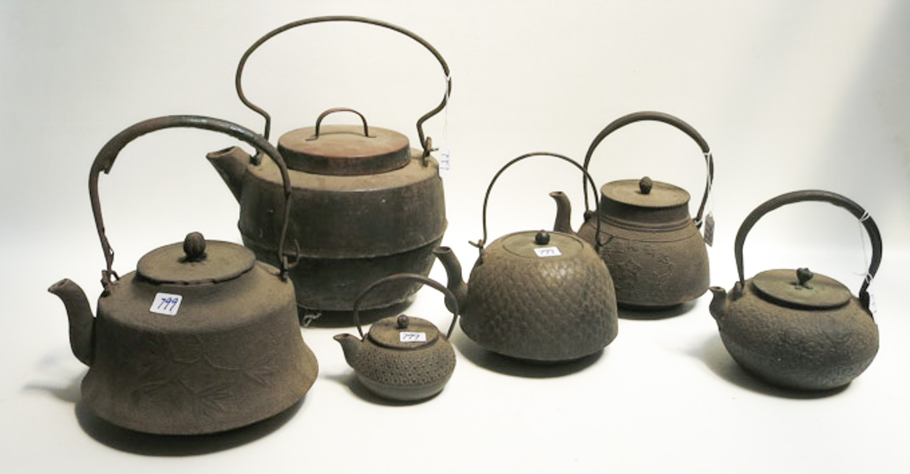 Appraisal: COLLECTION OF SIX JAPANESE IRON TEAPOTS various sizes and motifs