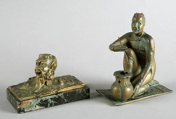 Appraisal: A group of bronze decorations Comprising a paperweight with a