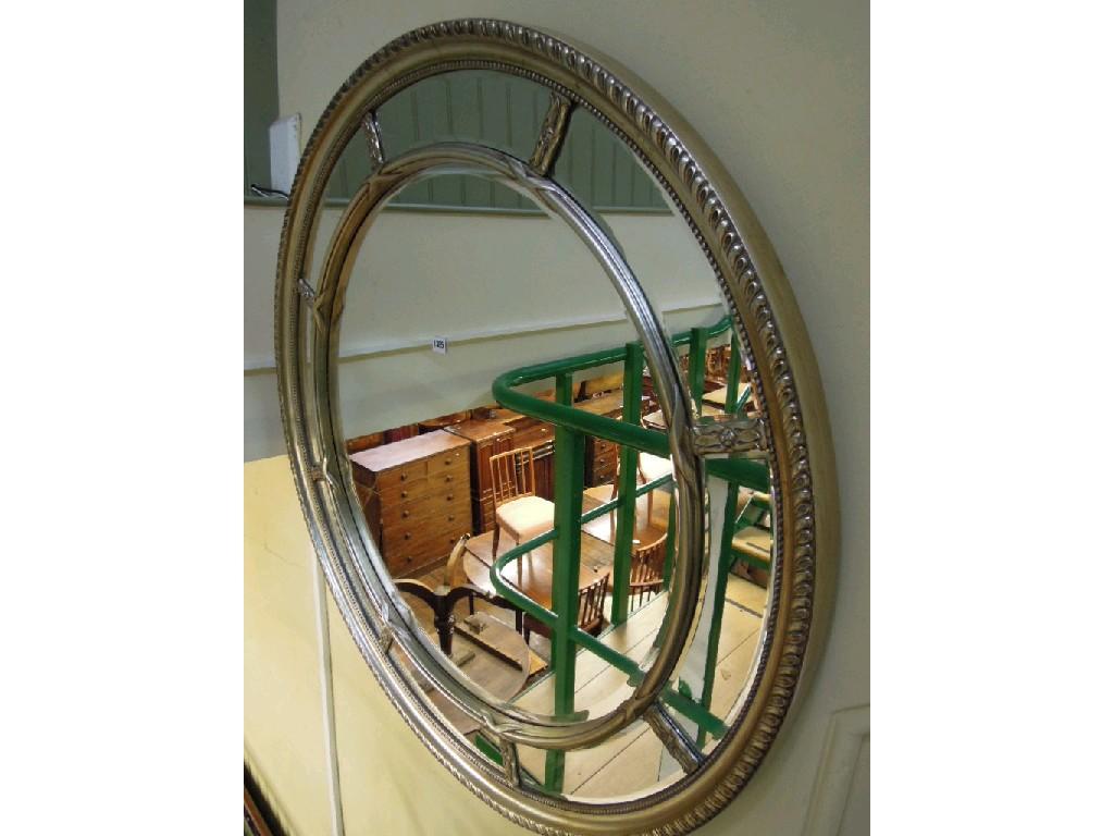 Appraisal: A large Regency style wall mirror of circular form the