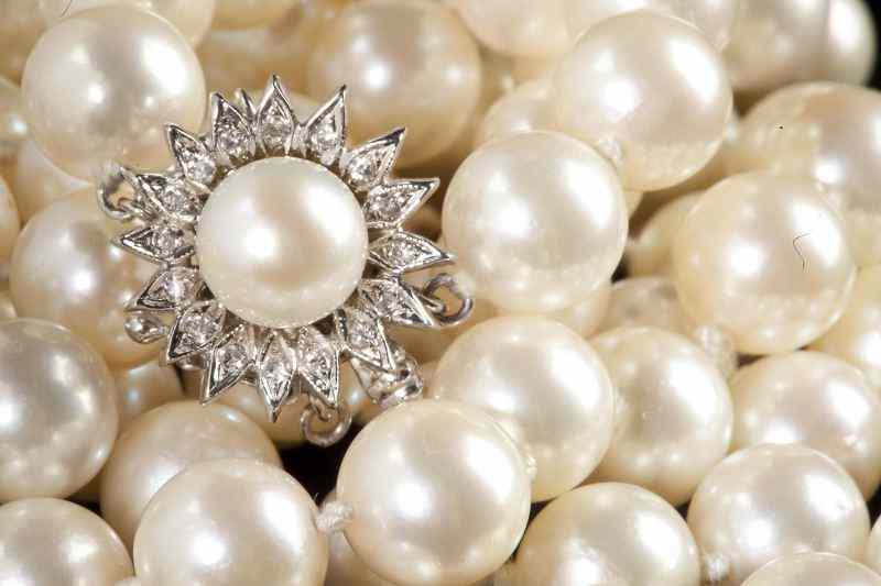 Appraisal: Opera Length Pearl Necklace with Diamond Claspcomprised of cultured pearls