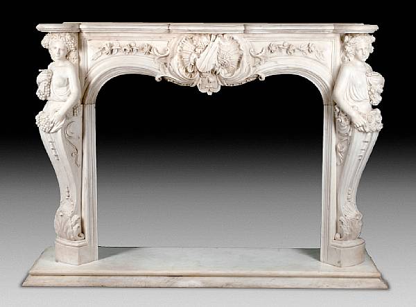 Appraisal: A carved marble fire surround The shaped marble shelf over