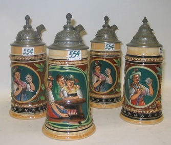 Appraisal: A GROUP OF FOUR GERMAN POTTERY BEER STEINS L size