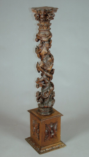 Appraisal: A th century and later carved oak torchere stand the