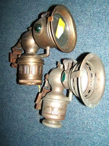 Appraisal: A MILLER REGALITE CARBIDE BICYCLE LAMP together with a further