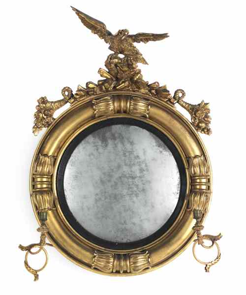 Appraisal: Giltwood convex mirror late th c with two candlearms and