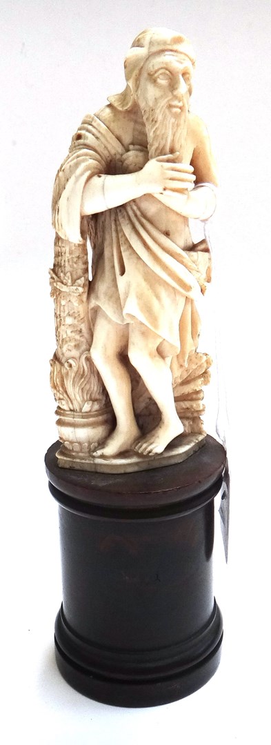 Appraisal: A Continental carved ivory figure th century modelled as a