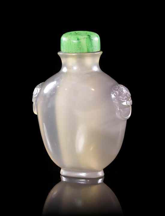 Appraisal: A Carved Agate Snuff Bottle of compressed flask form having