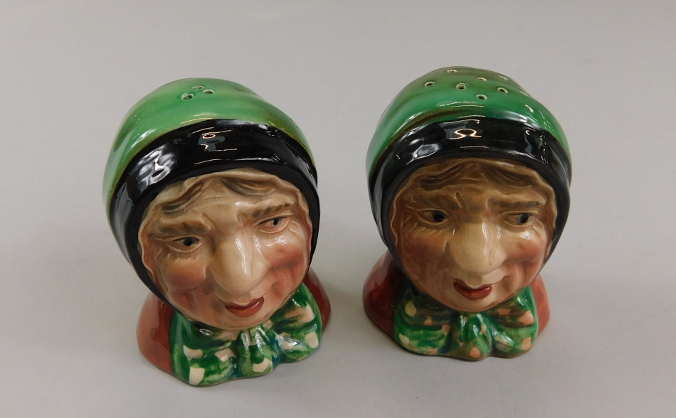 Appraisal: A pair of Beswick salt and pepper pots featuring lady