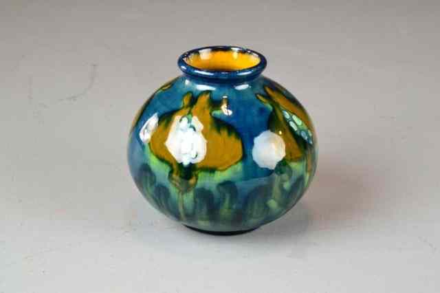 Appraisal: A Moorcroft Style Glazed Pottery VaseHighly glazed squat vase in