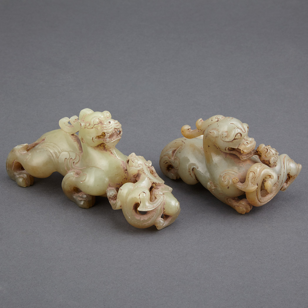 Appraisal: Two Chinese Archaic Style Celadon Jade Qilin Each carved confronting