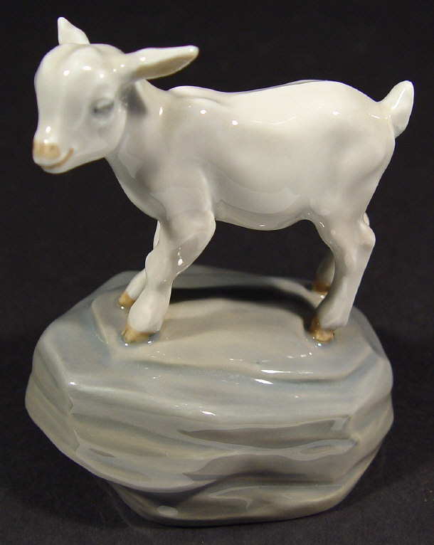 Appraisal: Royal Copenhagen porcelain lamb on a rocky base with hand