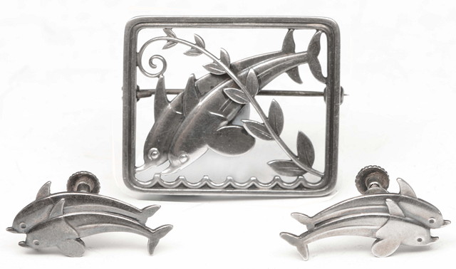 Appraisal: A GEORG JENSEN SILVER BROOCH of two dolphins in a