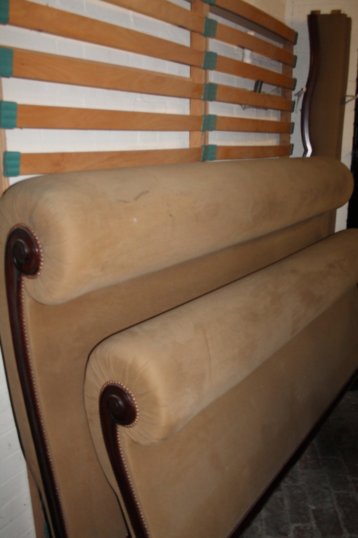 Appraisal: A Victorian mahogany and over stuffed sleigh style bed of