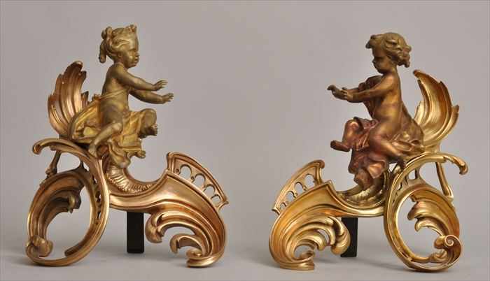 Appraisal: PAIR OF LOUIS XV-STYLE GILT-BRONZE CHENETS Modeled as a baby