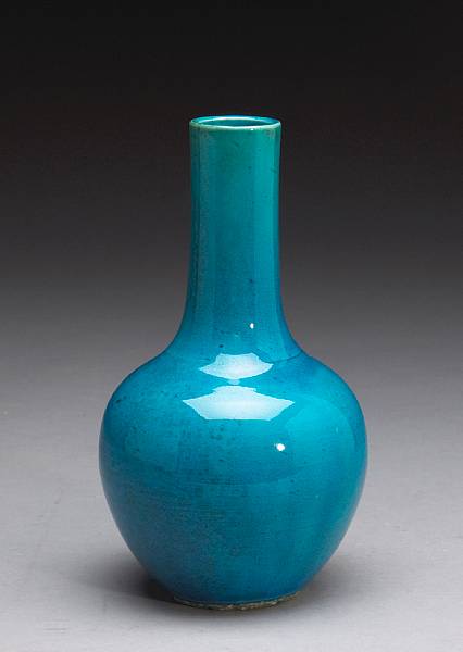 Appraisal: A turquoise glazed porcelain stick neck vase th Century The