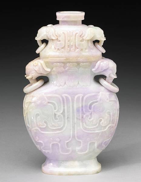 Appraisal: A lavender jadeite vase and cover Carved as a stylized