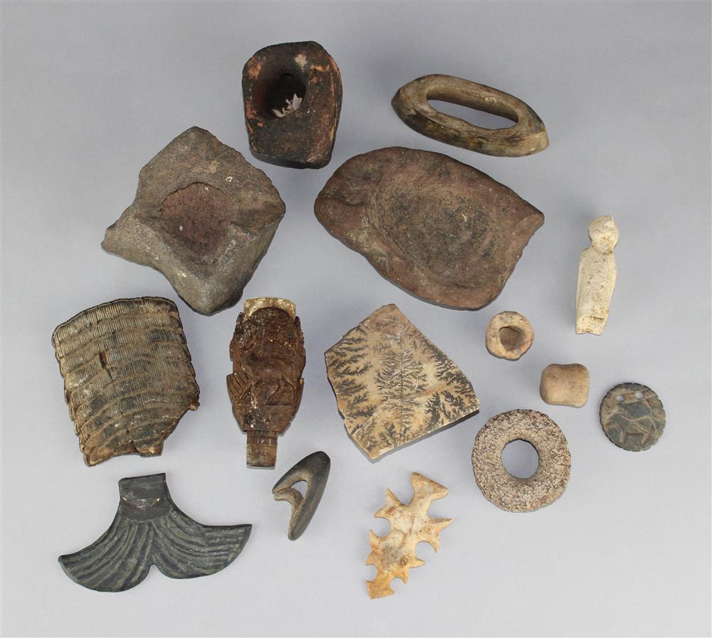 Appraisal: GROUP OF STONE AND CLAY ARTIFACTS including fossils pipes and