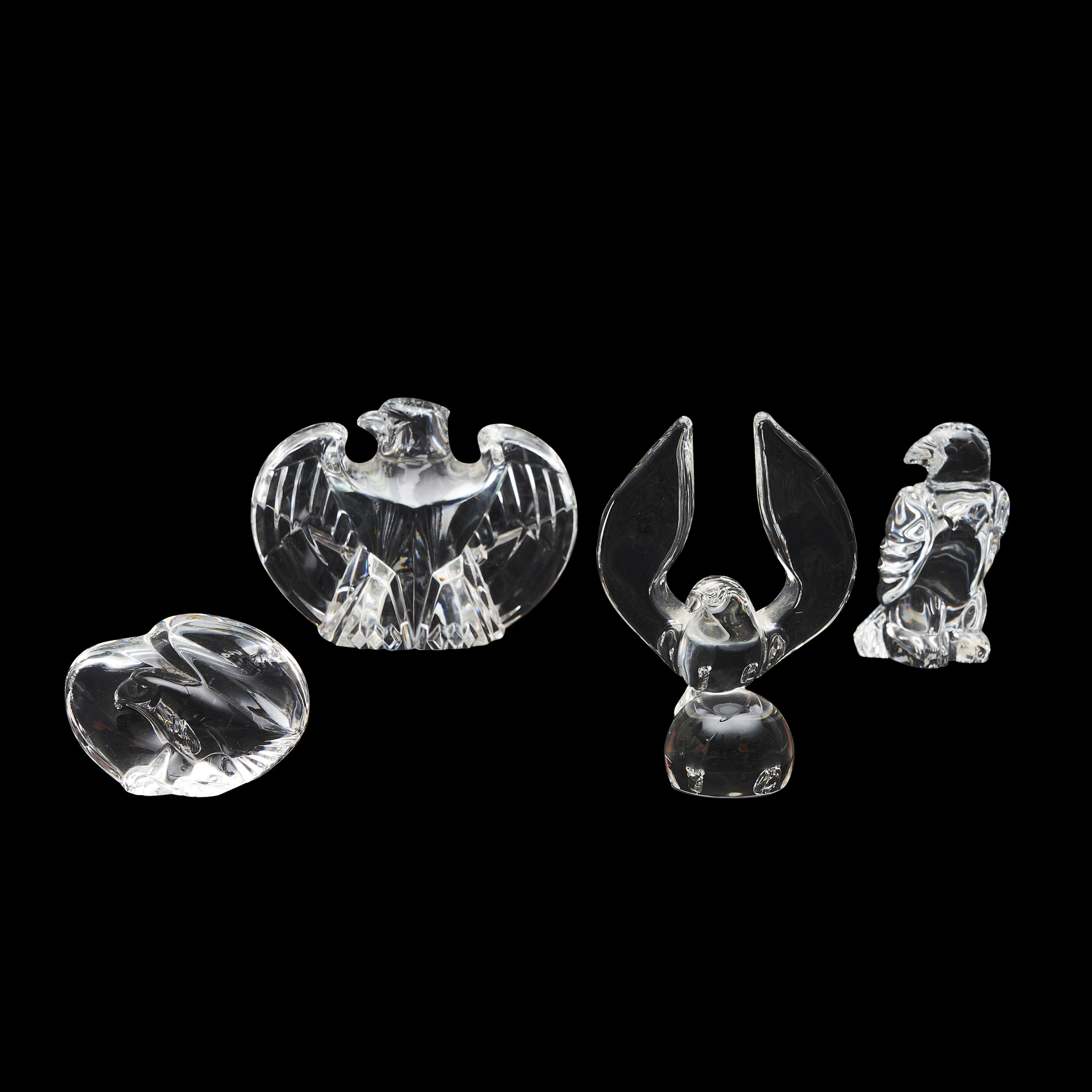 Appraisal: THREE STEUBEN GLASS EAGLES AND AN UNMARKED GLASS DOVE FIGURE