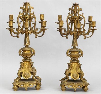 Appraisal: PAIR OF BAROQUE-STYLE SIX-LIGHT CANDELABRA Each husk-hung urn with guilloche