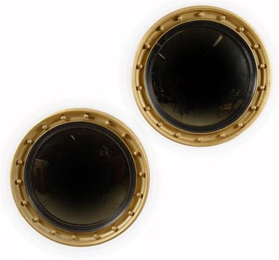 Appraisal: A pair of Regency style convex mirrors each with an