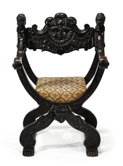 Appraisal: Renaissance style walnut savonarola chair Of typical form the back