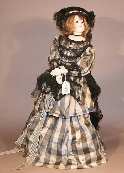 Appraisal: A French fashion style bisque-head doll unmarked the swivel-head with