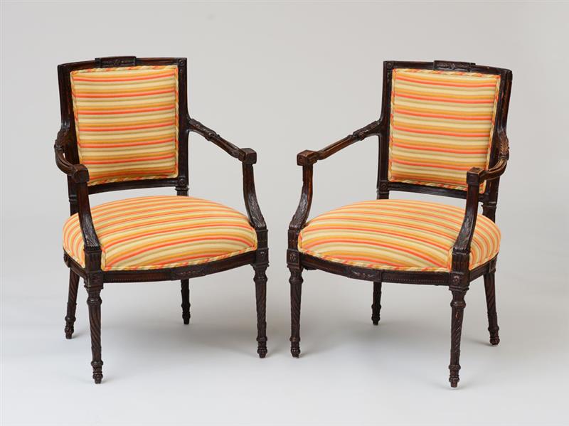 Appraisal: PAIR OF ITALIAN NEOCLASSICAL STAINED WALNUT ARMCHAIRS Each with an