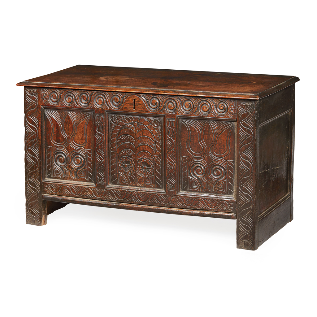 Appraisal: CARVED OAK TRIPLE PANEL CHEST TH CENTURY the hinged top