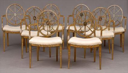 Appraisal: SET OF EIGHT GEORGE III-STYLE PAINTED WHEEL-BACK ARMCHAIRS Each oval