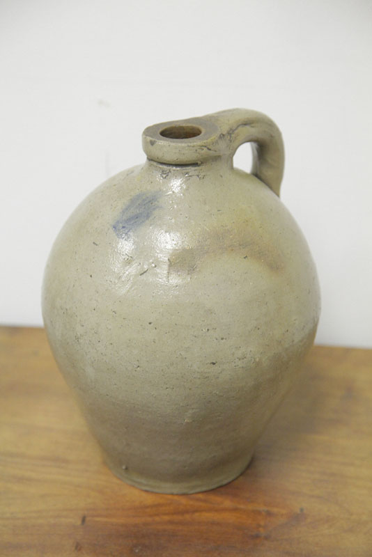 Appraisal: STONEWARE JUG Ovoid form having an applied strap handle and