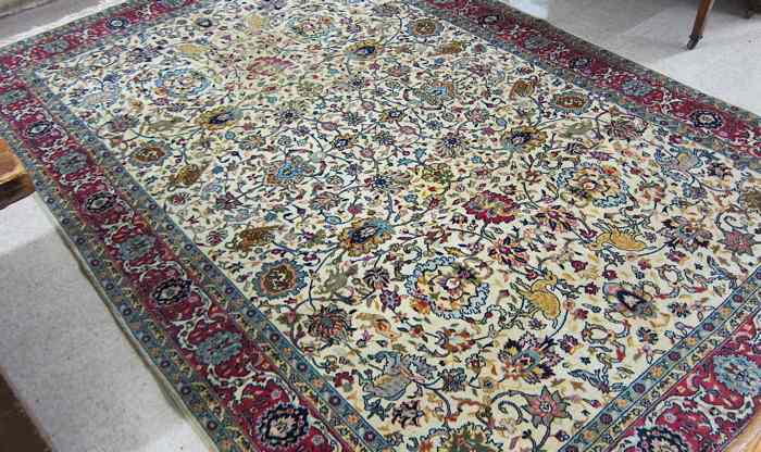 Appraisal: HAND KNOTTED ORIENTAL CARPET Pakistani-Persian overall Isfahan floral design on