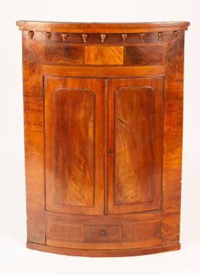 Appraisal: A William IV mahogany bowfronted hanging corner cupboard circa the