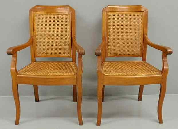 Appraisal: Pair of French inlaid fruitwood open armchairs with caned backs