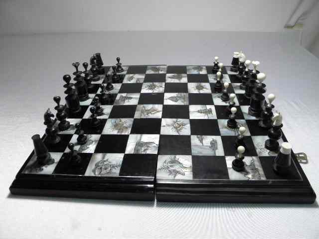 Appraisal: Black lacquer and etched mother of pearl inlay chess set