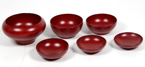 Appraisal: A set of six red lacquer stacking bowls of graduated