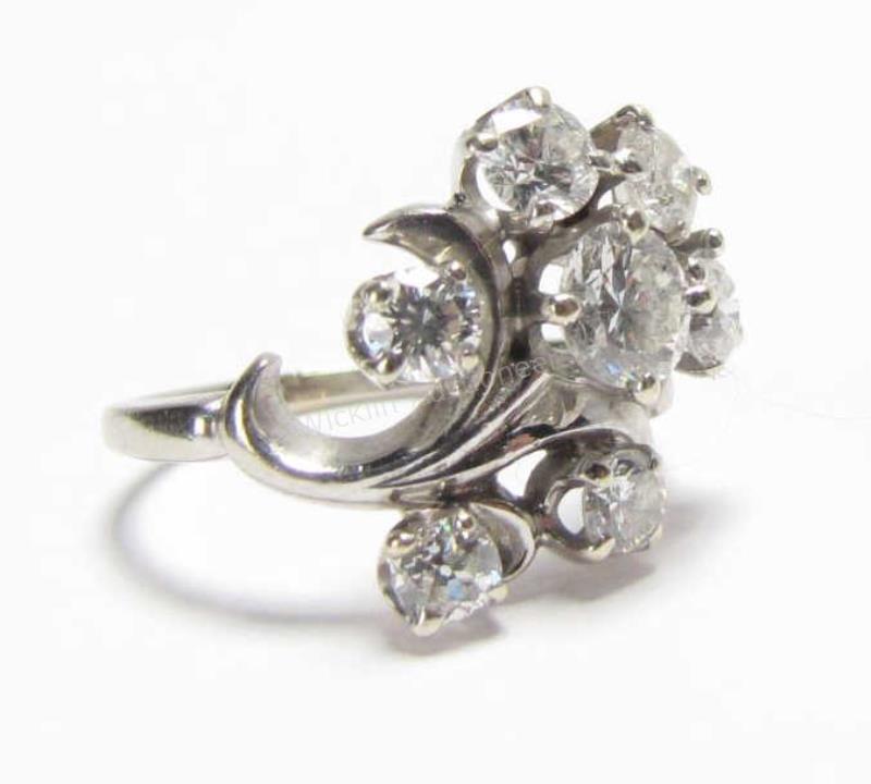 Appraisal: A K white gold lady's cluster style ring with seven