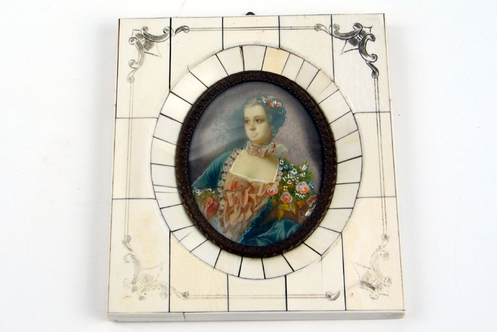 Appraisal: MINIATURE FRENCH OIL portrait of a beautiful woman with flowers