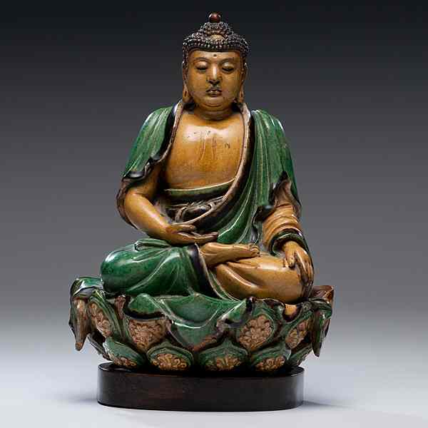 Appraisal: Stoneware Green and Yellow Buddha Chinese a stoneware buddha with