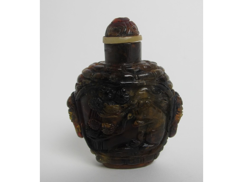 Appraisal: A Chinese amber snuff bottle decorated with squirrels and pine