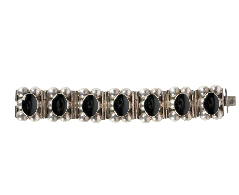 Appraisal: MEXICAN STERLING STONE BRACELETcontaining seven oval cabochon cut black stones