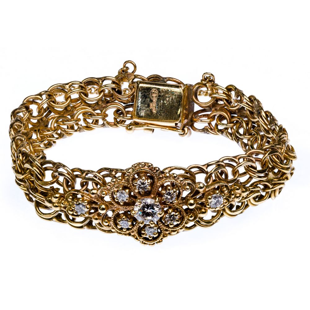 Appraisal: K YELLOW GOLD AND DIAMOND BRACELETFiligree bracelet centrally set with