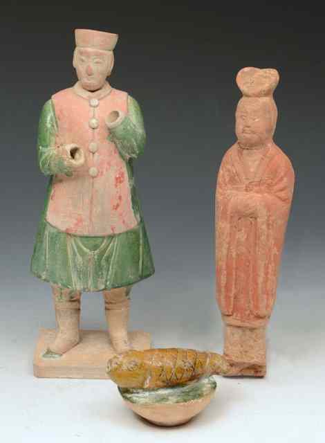 Appraisal: A CHINESE TERRACOTTA and glazed figure Tang Dynasty a cover