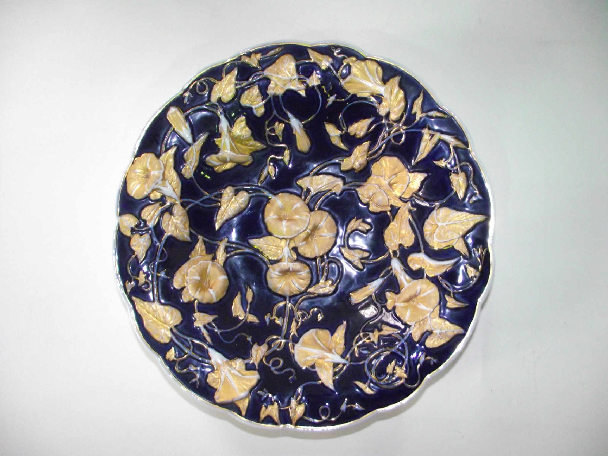 Appraisal: A th century Meissen dark blue ground dish with moulded