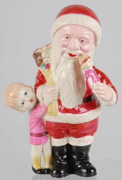 Appraisal: Unusual Celluloid Santa Description With young girl at side holding