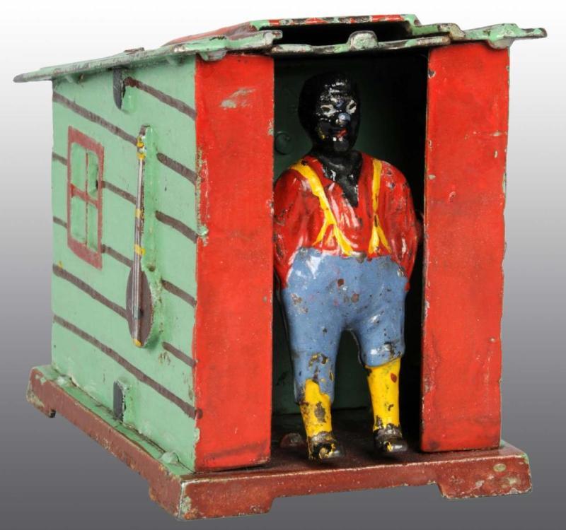 Appraisal: Cast Iron Cabin Bank Mechanical Bank Description Manufactured by J