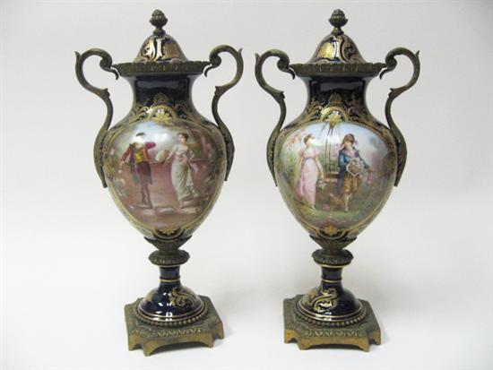 Appraisal: A Pair of Ormolu Mounted Sevres Urns with hand painted