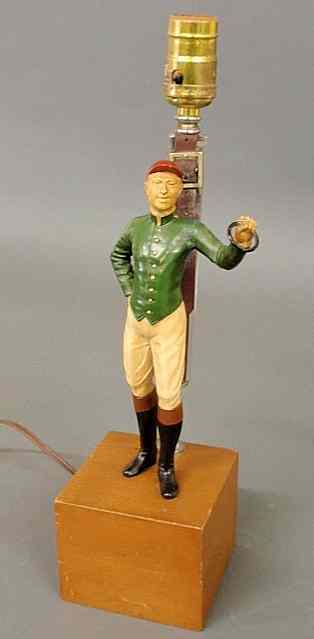 Appraisal: Jockey Club lamp with a Painted metal jockey and stirrup