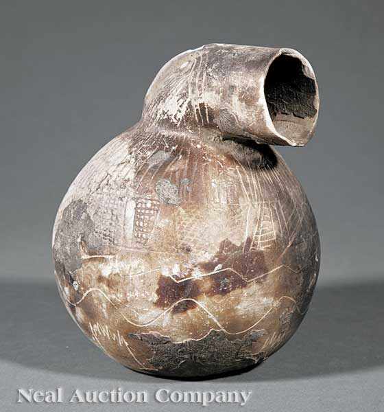 Appraisal: A Pre-Columbian Pottery Vessel bird-form bulbous body with cylindrical beak-like