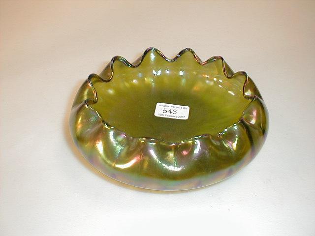 Appraisal: A Loetz style iridescent green bowl with crimped lip dia